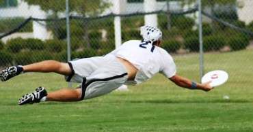 This photo of an ultimate player making a layout catch during Ultimate Tournemant play was taken by Adam Ginsburg and is used courtesy of the Creative Commons Attribution and ShareAlike 2.5 License.